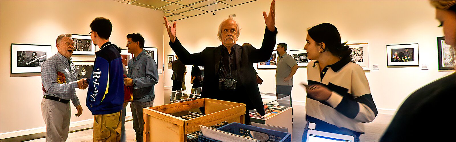 Artist and 83 Degrees Media photographer Jay Nolan celebrates at the FMoPA opening reception of his black-and-white photo exhibit of  famous rock bands and shows.