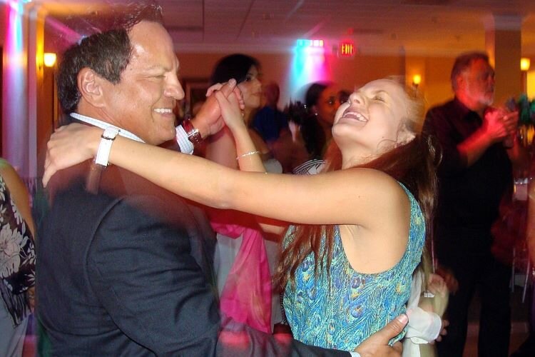 Michael Ortoll dances with his daughter Christine Ortoll.