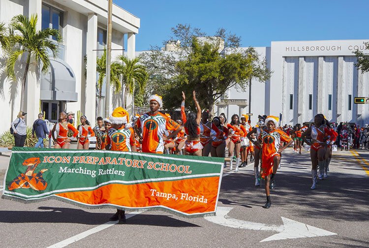 Icon Preparatory School marching band helps lead the parade through downtown at Tampa's Santa Fest & Tree Lighting.