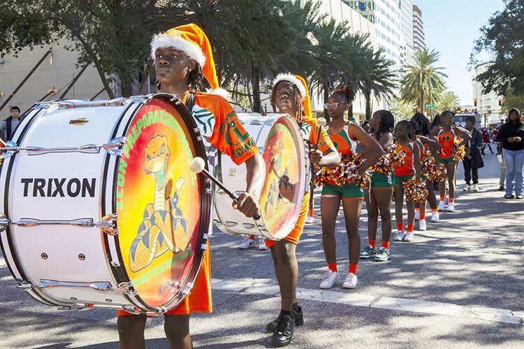 The Icon Preparatory School marching band helps lead the parade through downtown at Tampa's Santa Fest & Tree Lighting.