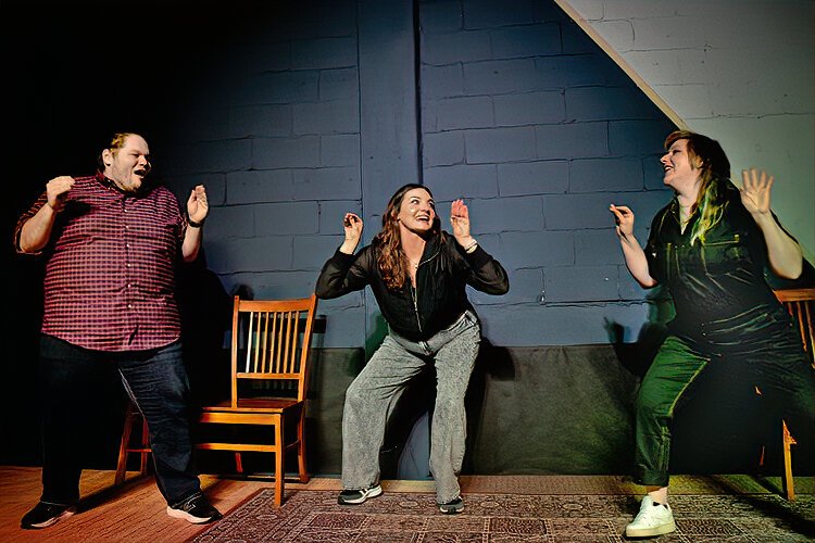 Dan Richard, Liz Marcucci, and Emi Rey transform into talking crabs in their improv act at The Commodore in Ybor City.