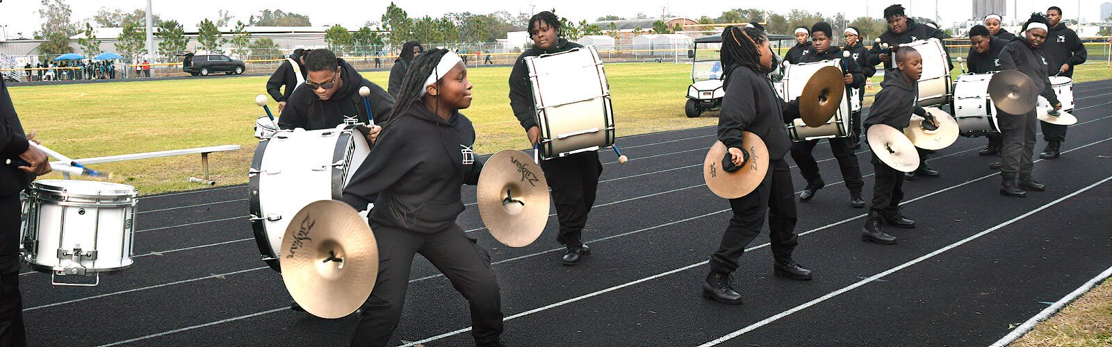 The young cymbalists from Hollis Innovation Academy’s drumline perform with gusto during the MLK Battle of the Bands.