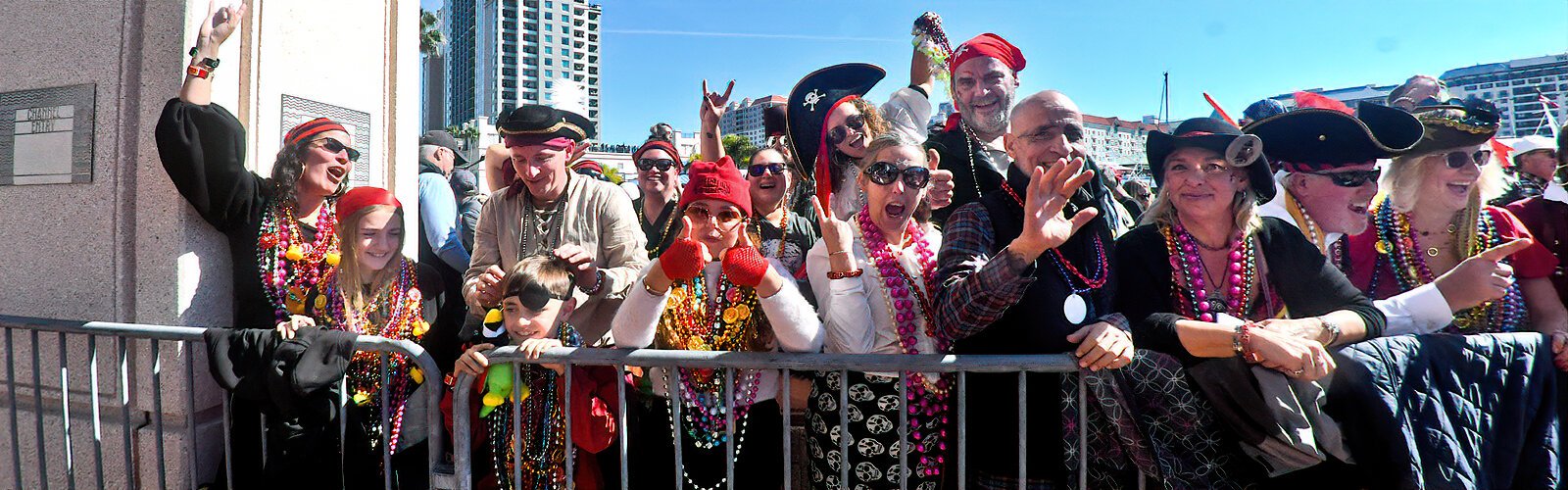 Excited attendees greet the invading Gasparilla pirates at the Tampa Convention Center.