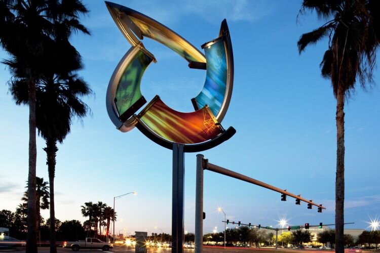 The sculpture "Kinetic Ring" by artist Catherine Woods, shown here at its former home at Kennedy and Memorial, may be moved out of storage and relocated to Cypress Point Park as part of the Westshore District public art initiative.