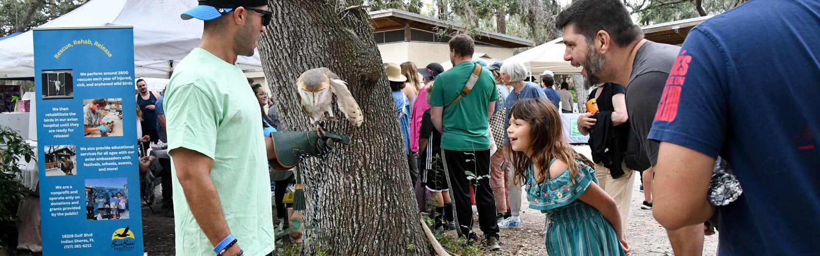 Visitors are smitten with the raptors they discover at the Boyd Hill Nature Preserve festival and Cyprus, the barn owl handled by Kyle (Seaside Seabird Sanctuary) is no exception. 