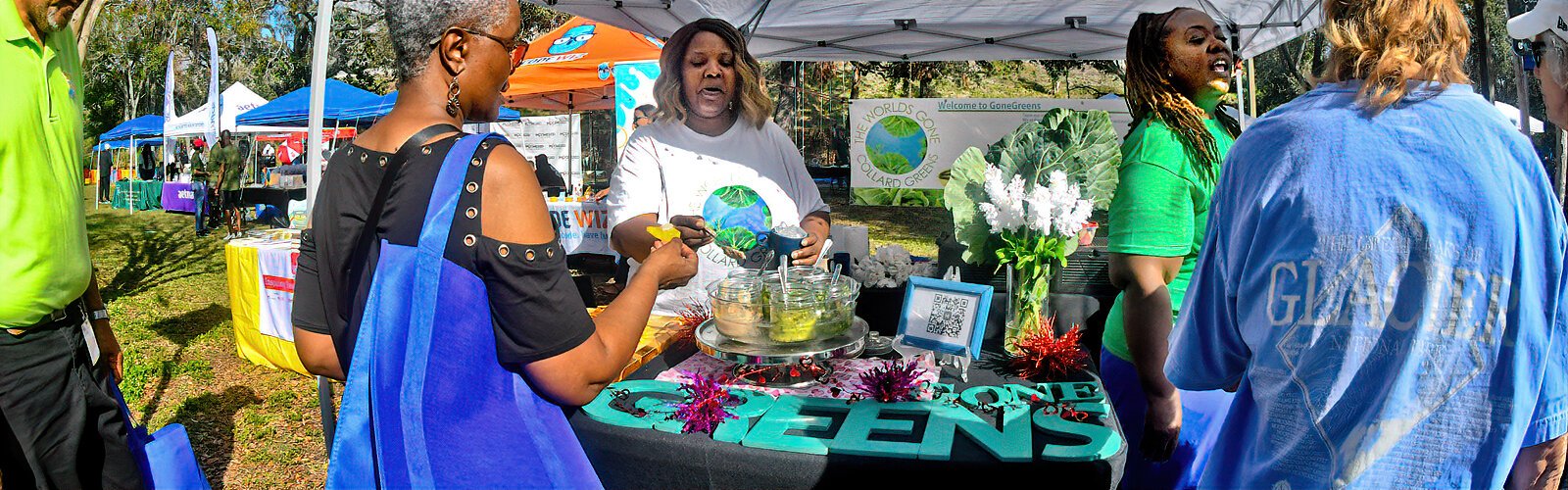 The Collard Green Festival crowd gets to sample a variety of GoneGreens collard green condiments at The Worlds Gone Collard Greens taste table.