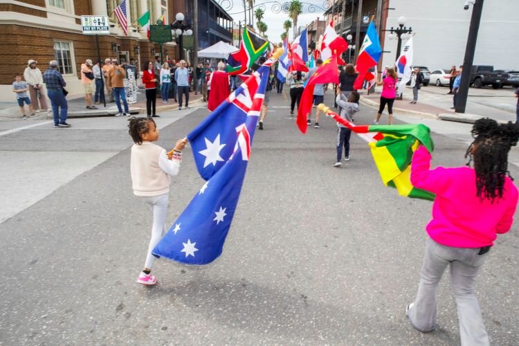 The Promenade of Flags, which showcases the countries whose immigrants made Ybor City their home, marches down “La Septima” (Seventh Avenue)  during the Ybor City Chamber of Commerce's 78th Annual Fiesta Day.