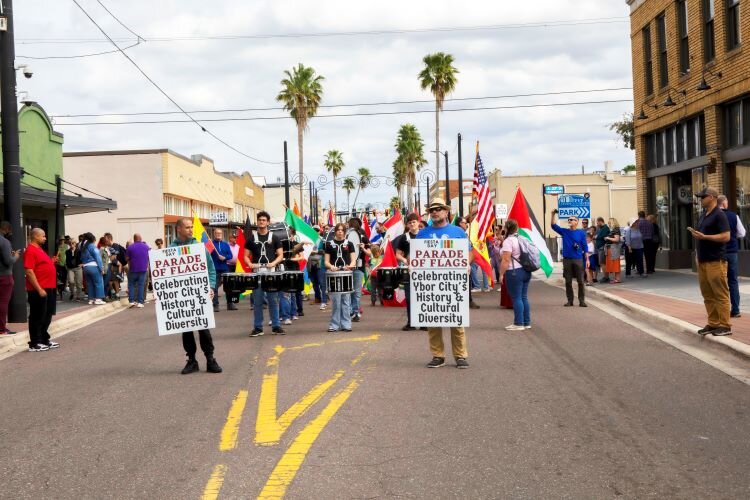 The Promenade of Flags moves down Seventh Avenue during the 78th Ybor Fiesta Day