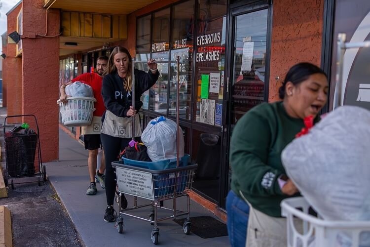 Through October, Laundry Project volunteers had worked 22 hurricane relief free-laundry events at 17 Tampa Bay area laundromats helping nearly 3,000 people wash almost 80,000 pounds of clothes.