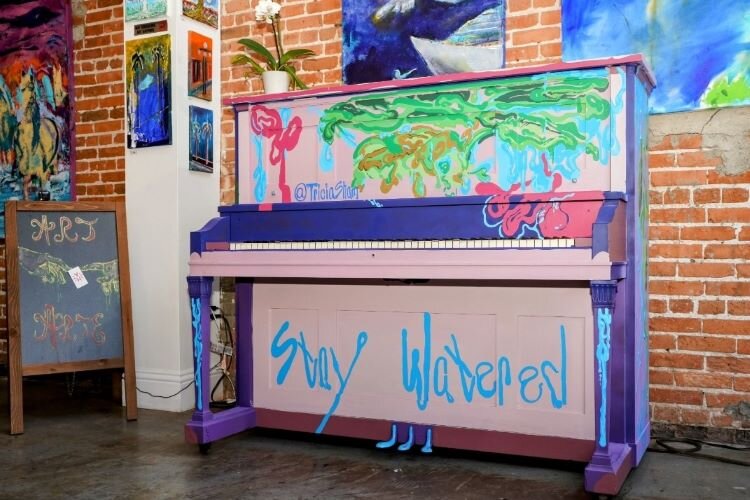 Painted by artist Tricia Sham, "Stay Watered" at Marcolina's Fine Arts Gallery is one of several pianos Tampa Tunes has placed around Ybor City.